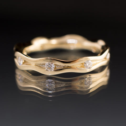 gold moissanite anniversary ring