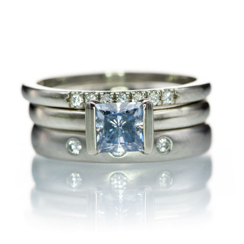 Princess blue moissanite ring stack with domed diamond wedding bands