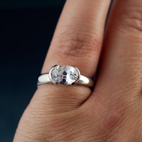 white sapphire solitaire ring