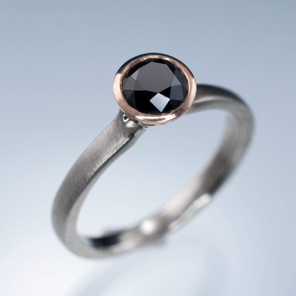 Blue diamond bezel engagement ring