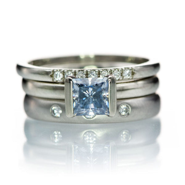 ring stack with princess ct blue moissanite, flush and french setset diamonds