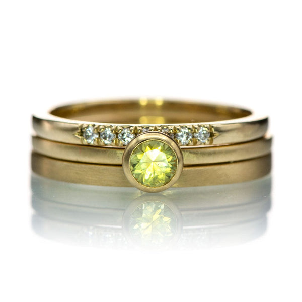 Yellow gold ring stack with a green Montana sapphire, a plain gold and Louise diamond band