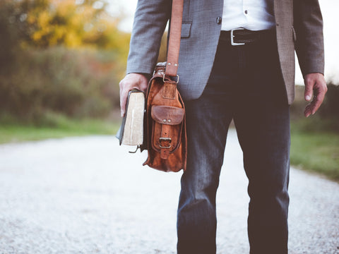 pastor carrying a bible