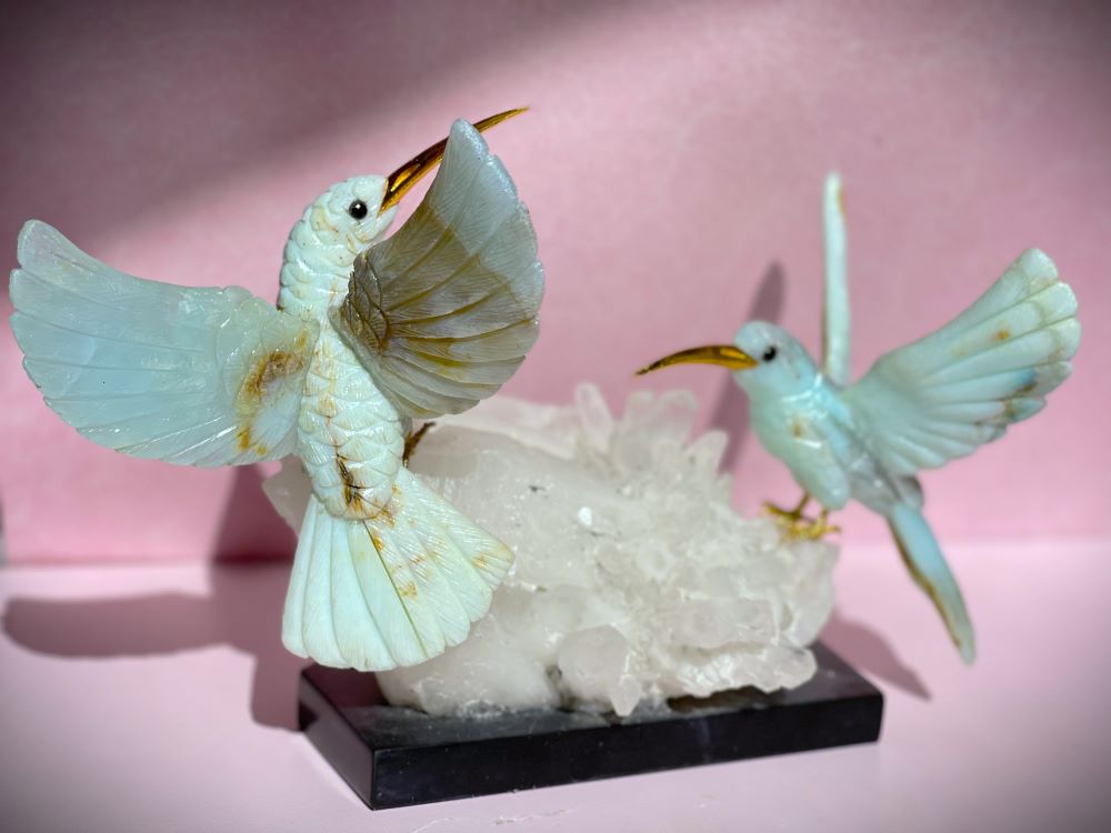 blue andean opal hummingbird statue on quartz