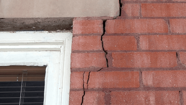 Foundations with low stiffness ratings cause structural failures with soil movement like this pier and beam foundation.