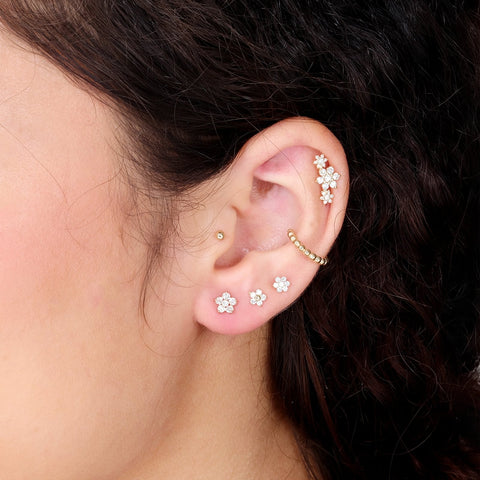 A woman’s ear with Estella Collection earrings