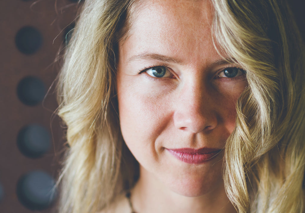 Mature woman looking at the camera with glowing skin