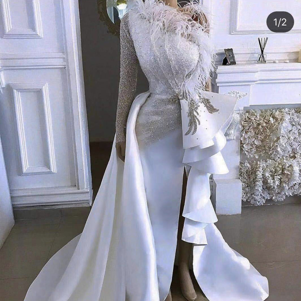 white prom dress with feathers