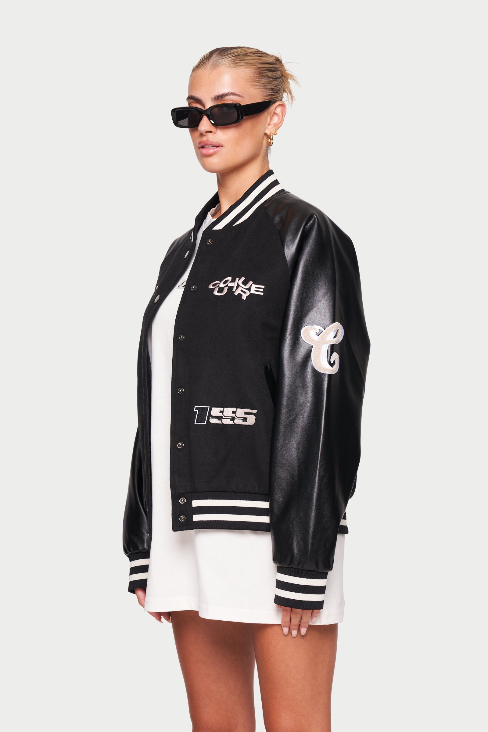 The Couture Club Satin Bomber Jacket with Varsity Badging in Black