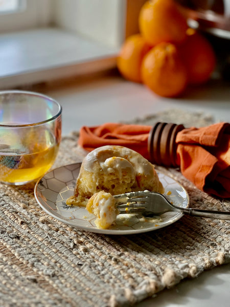 sweet orange roll with tea and fork