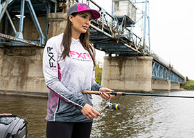 Action Photography: Women's Tournament Pro UPF Pullover Hoodie performing IRL 3