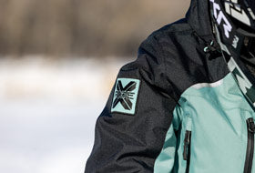 Action Photography: Women's Recruit F.A.S.T. Insulated Monosuit performing IRL 10