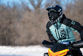 Action Photography: Women's Recruit F.A.S.T. Insulated Monosuit performing IRL 12