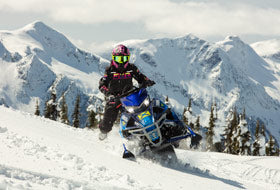 Action Photography: Women's Maverick F.A.S.T. Insulated Monosuit performing IRL 9