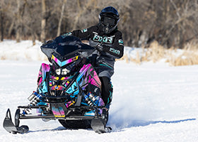 Action Photography: Women's Maverick F.A.S.T. Insulated Monosuit performing IRL 1