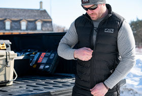 Action Photography: Men's Podium Hybrid Quilted Vest performing IRL 5