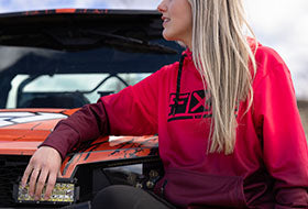 Action Photography: Women's Podium Tech Pullover Hoodie performing IRL 1