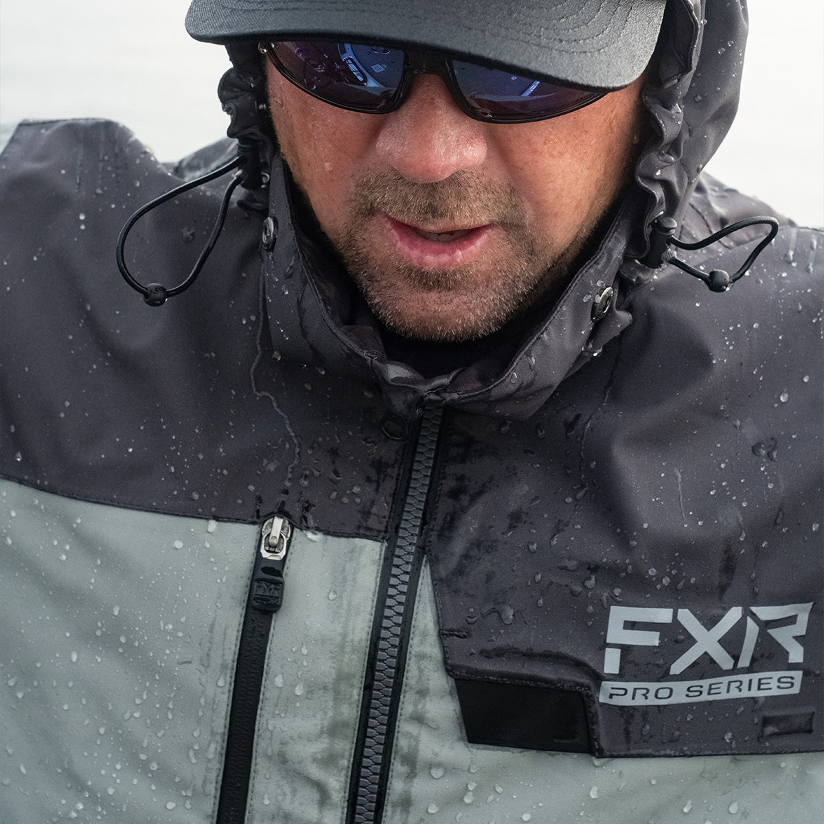 Picture of a guy out fishing in his FXR’s men’s charcoal black Vapor Pro Insulated Jacket with F.A.S.T. Float Assist Safety Technology