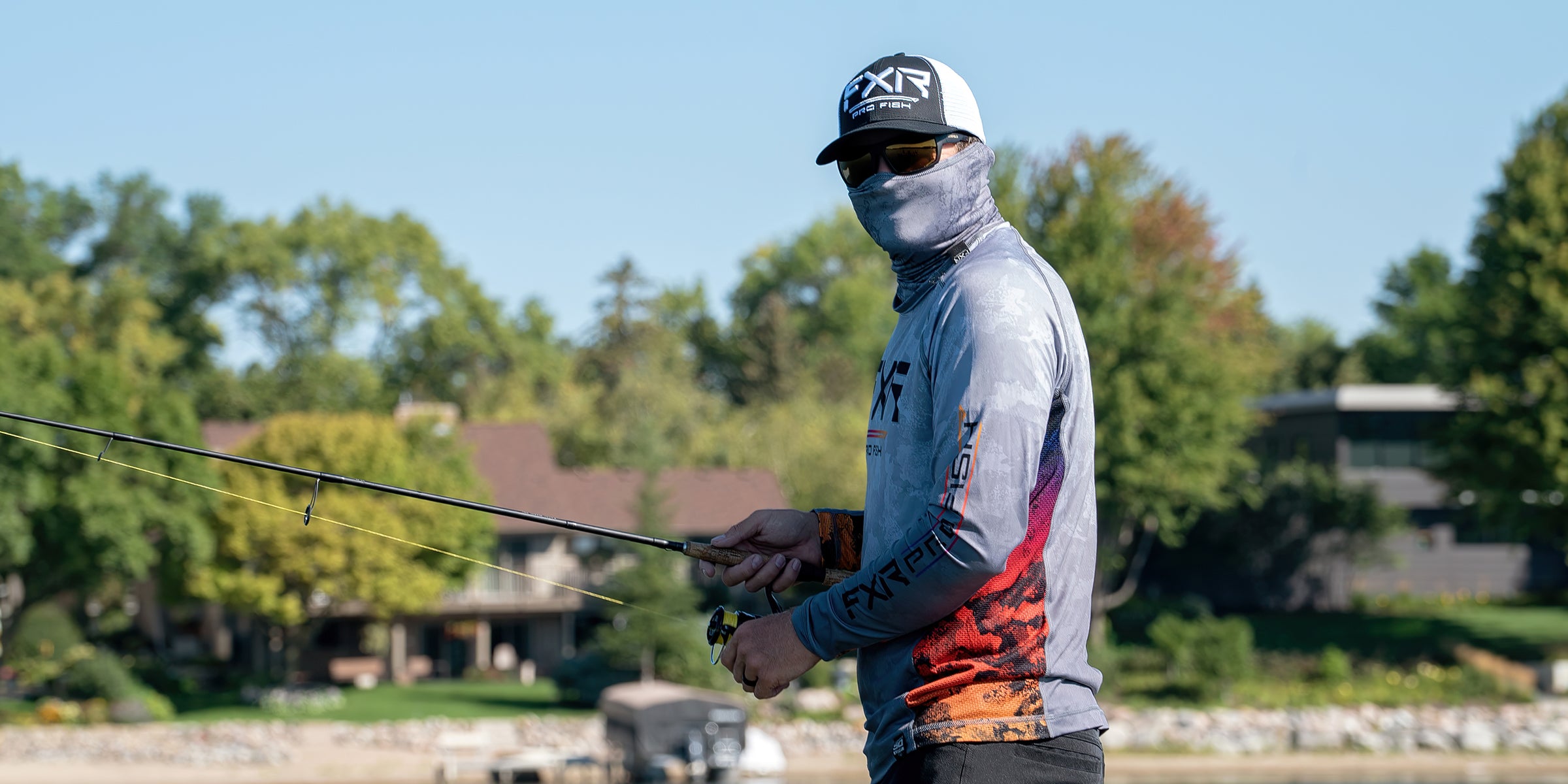 Image of two guys on a boat fishing with their FXR Tournament Hybrid Pro Hoodies