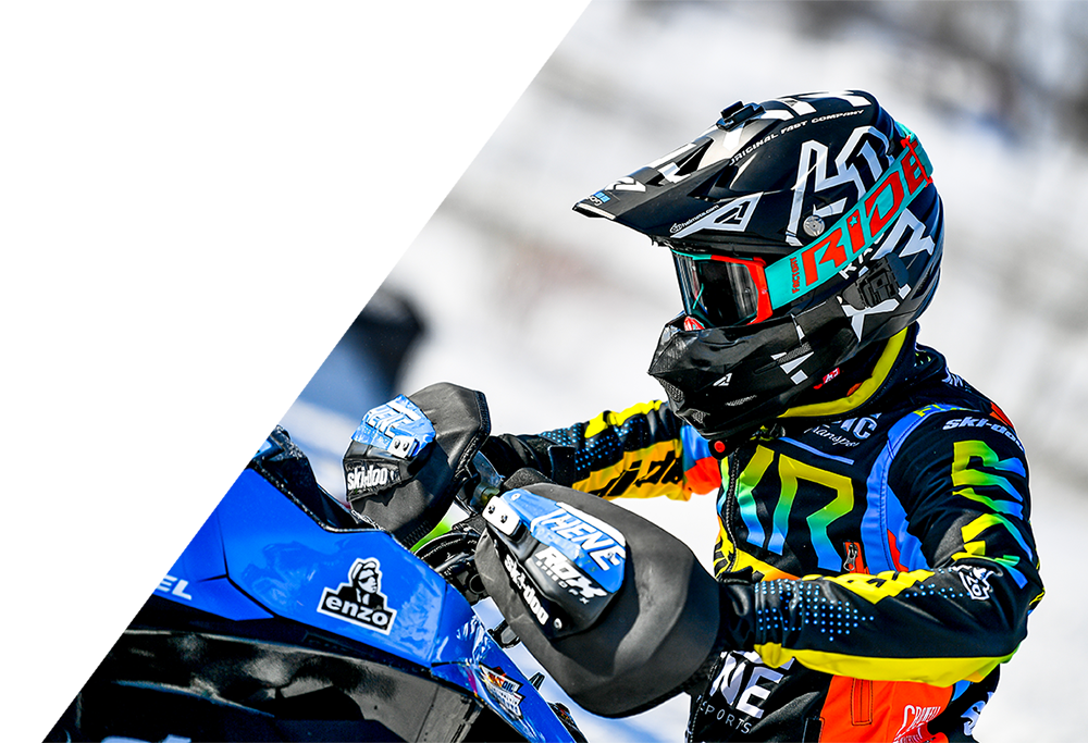 A guy on snowmobile wearing the Factory Ride Premium Optics Goggles