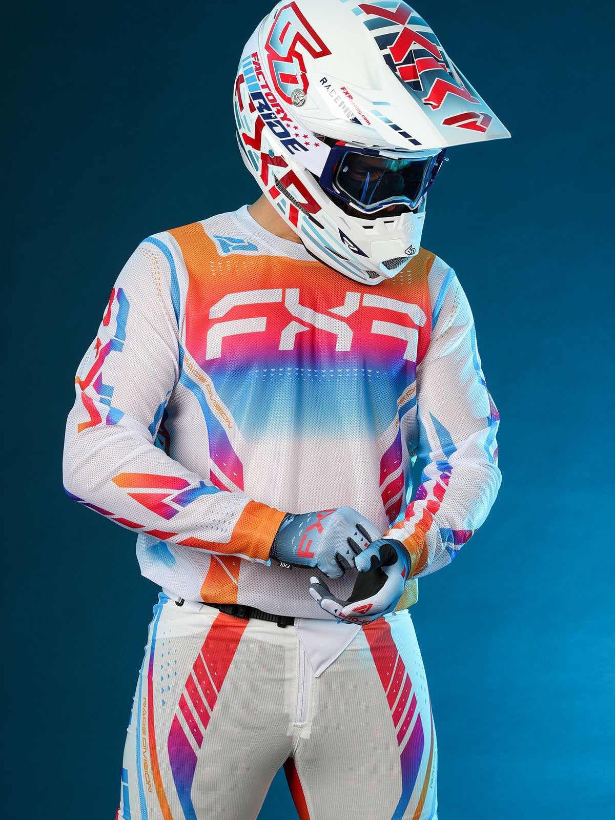 studio shot of a guy wearing FXR's Vapor Air Jersey and Pant