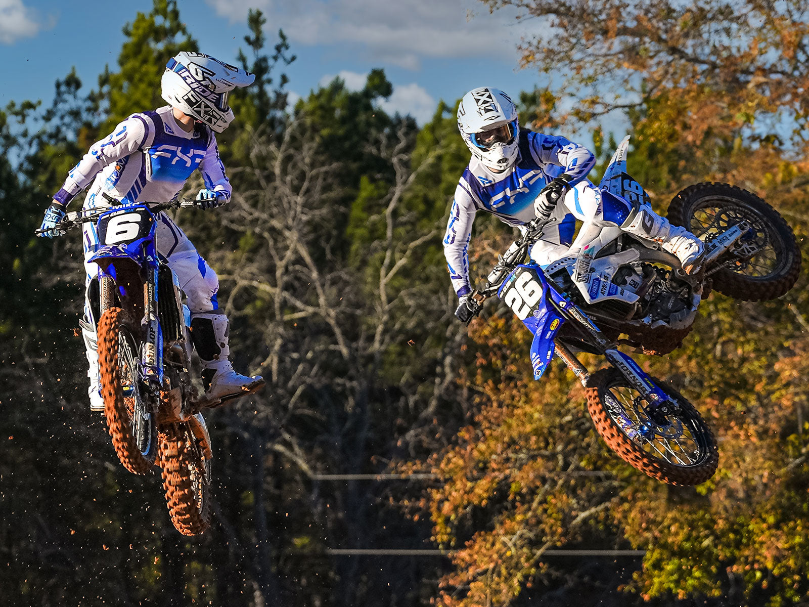 A jump-shot image of Jeremy Martin and Jett Reynolds in FXR's new 2024.5 LE Vapor Air kit in subzero colorway