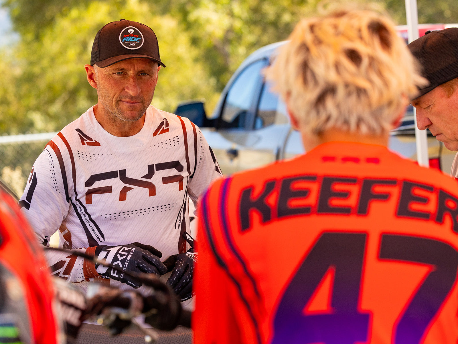 An image of Mike Brown and Aden Keefer featuring FXR's new 2024.5 LE Vapor kit in regal and bloodshot colorways