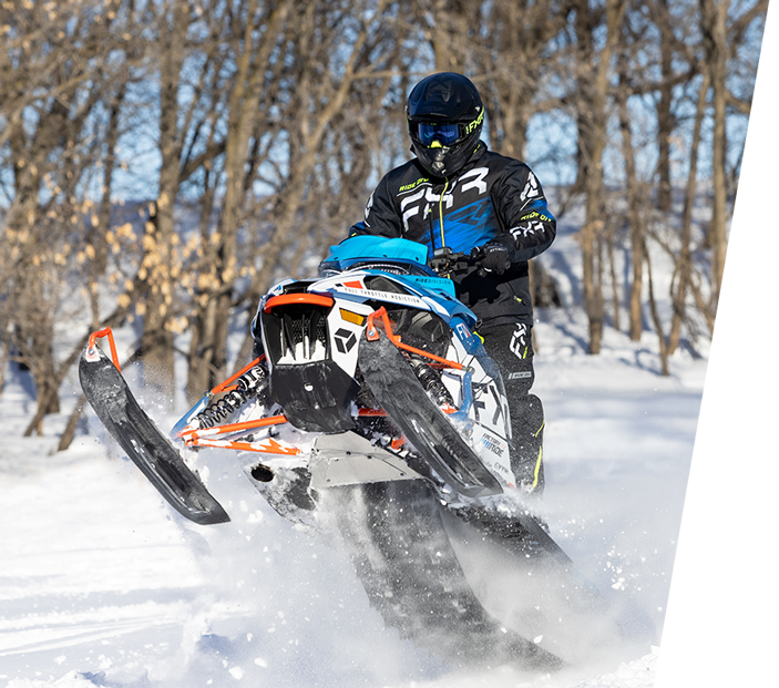 Image of a guy in a snowmobile wearing FXR's Men's Boost jacket