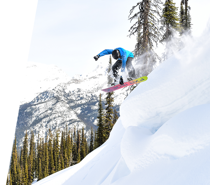 Image of guy coming down a hill snowboarding featuring FXR's Men's Ridge 2-in-1 Jacket