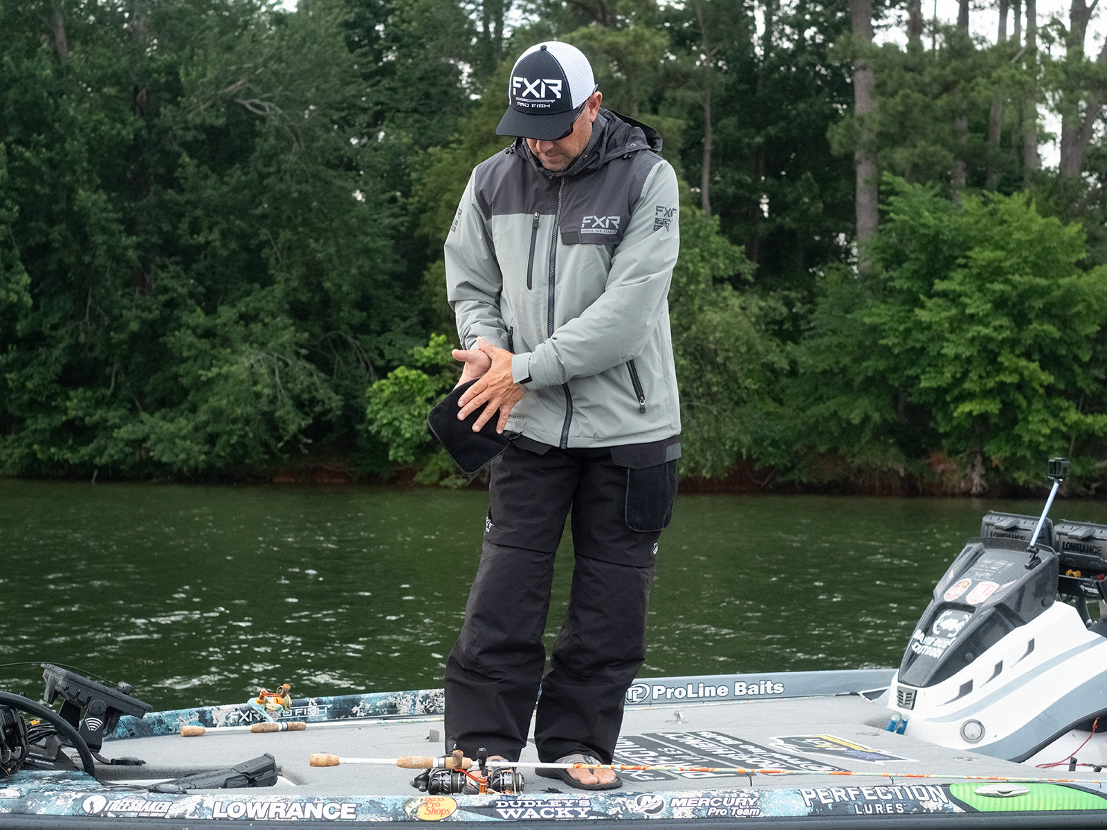 guy on a boat sporting the new FXR's Vapor Insulated Jacket