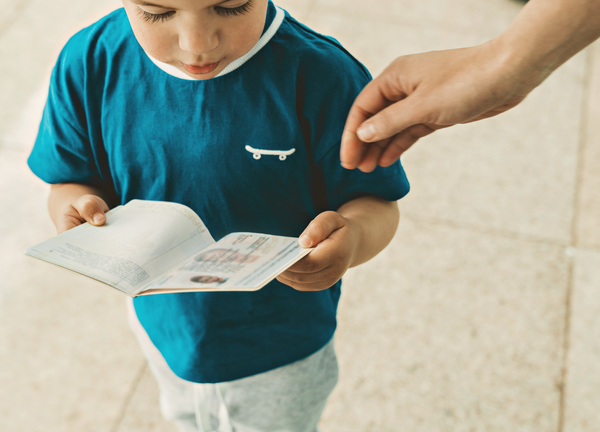 Child holding a passport