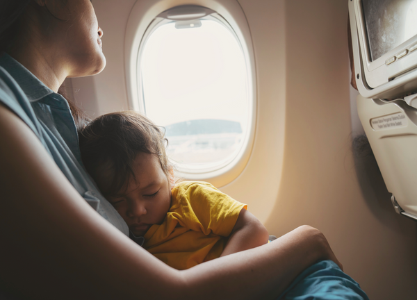 Toddler and mother on an airplane