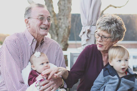 Older couple with their grandchildren