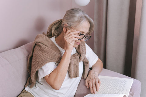 Elderly lady reading a book