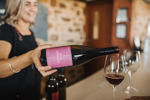 Cellar door manager pours a glass of our 2020 Grenache