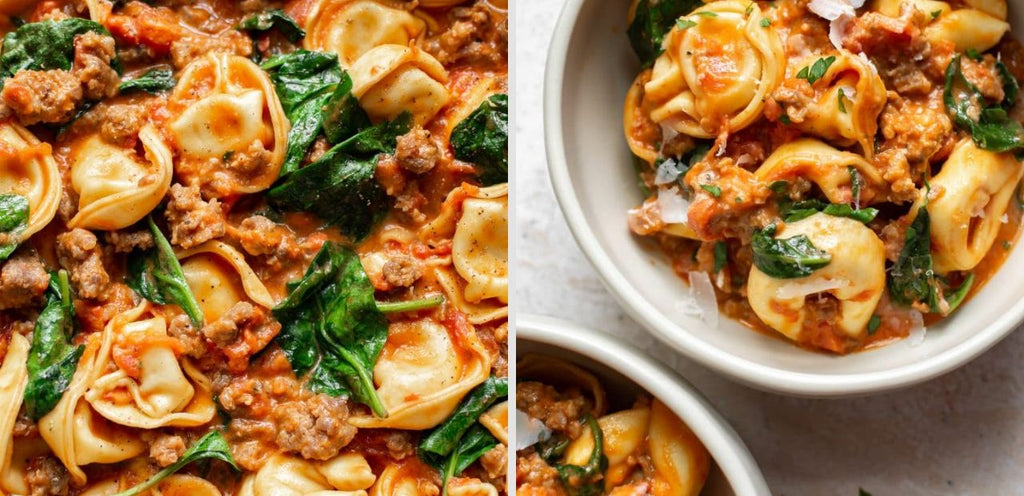 A tortellini dish is pictured, featuring fresh tortellini, spinach and sausage in a creamy tomato sauce.