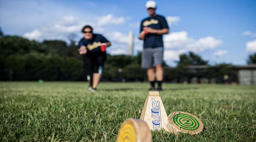 a person holding a baseball bat on a field