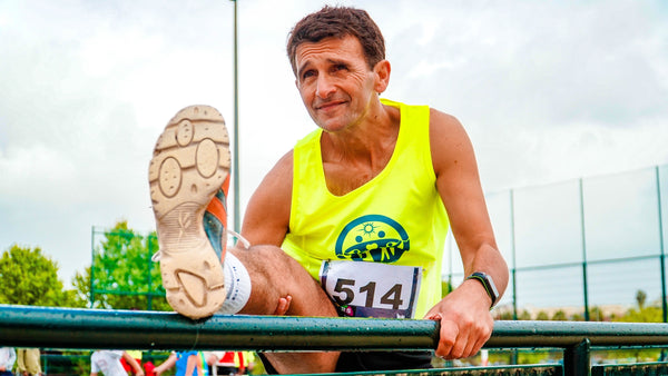 Older athlete stretching hmb sport