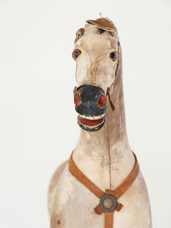 antique toy horse on wheels