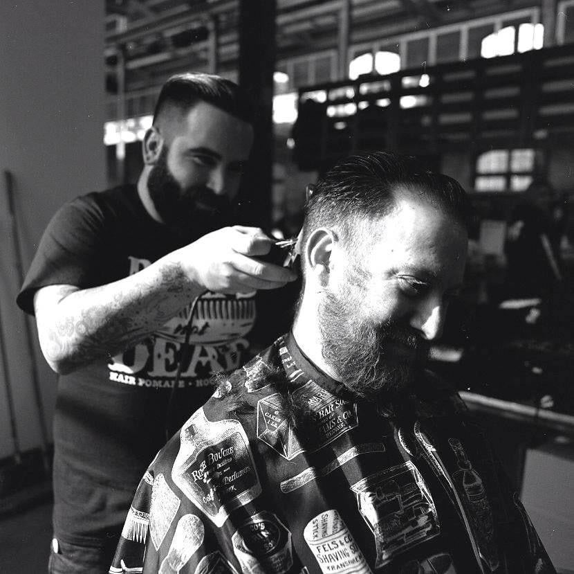 Zachary of Shear Revival cutting hair