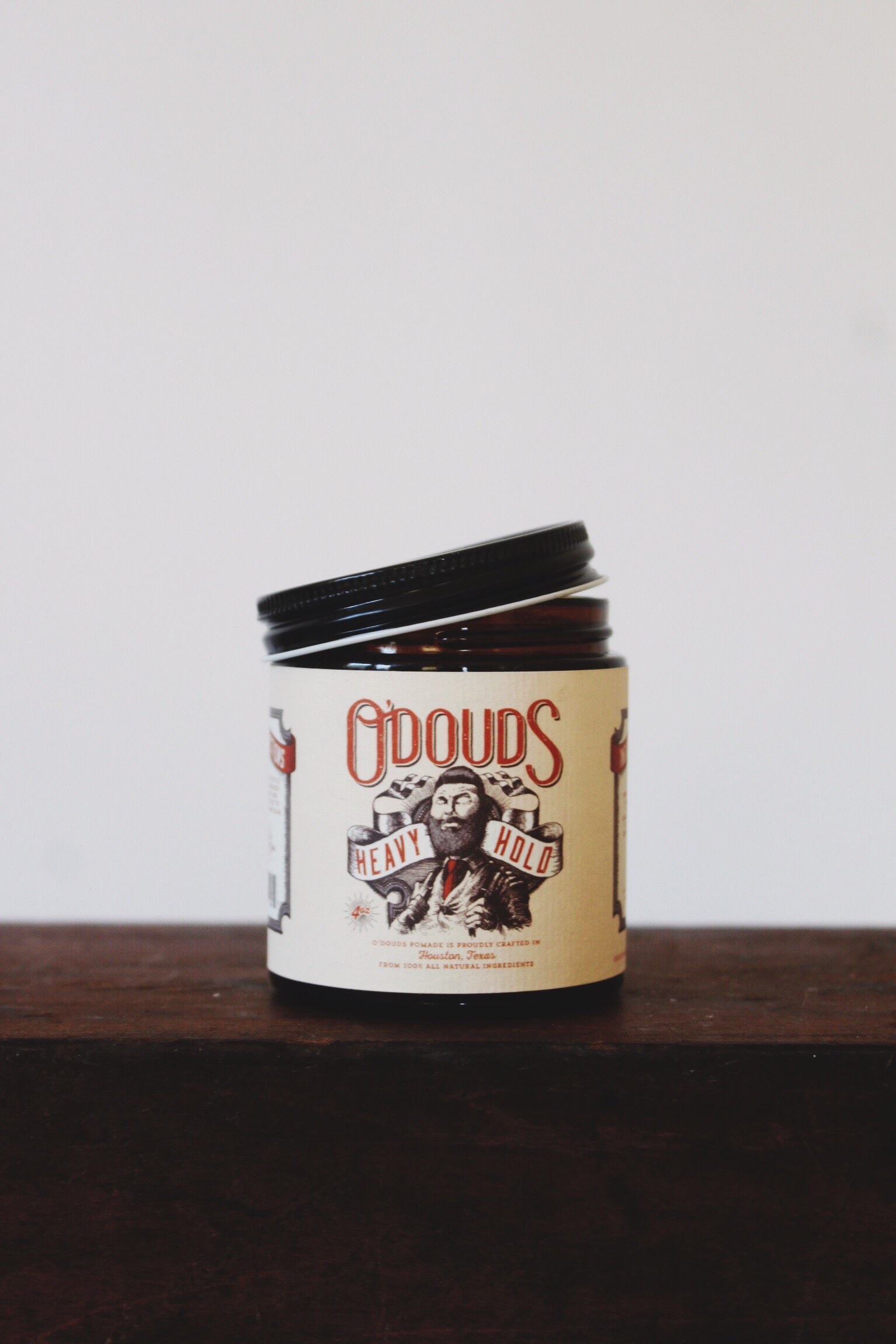 Jar of O douds heavy hold oil based pomade