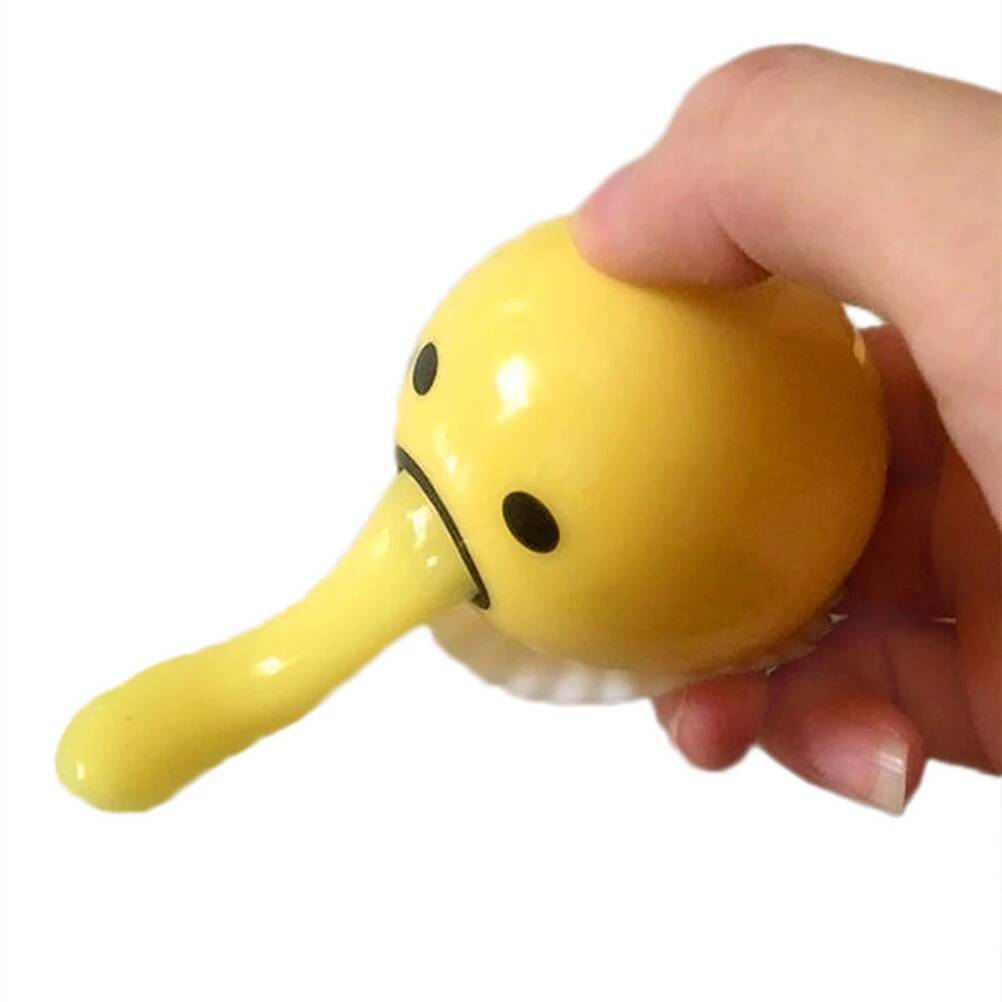 squishy puking egg yolk stress ball with yellow goop