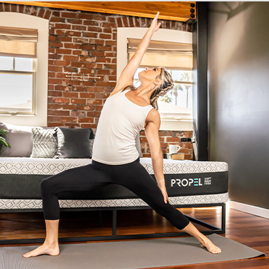 women stretching in front of propel bed