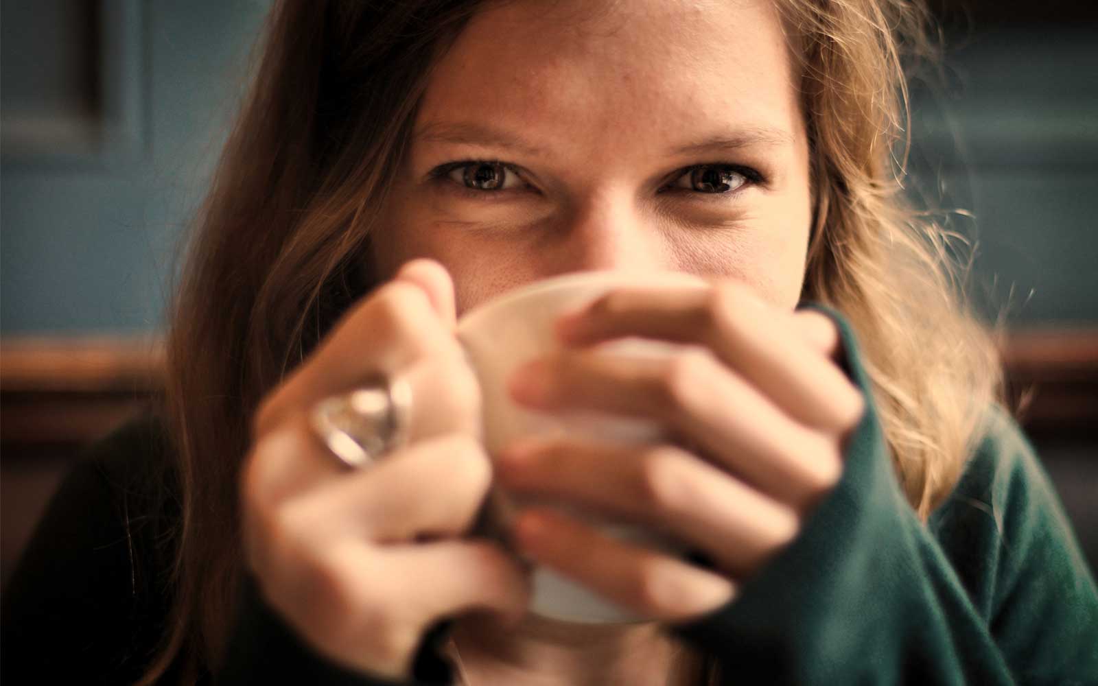 A girl tasting rooibos tea - main