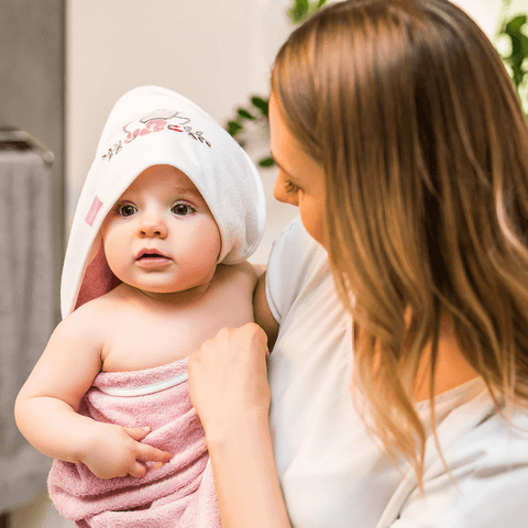 baby in towel with hood