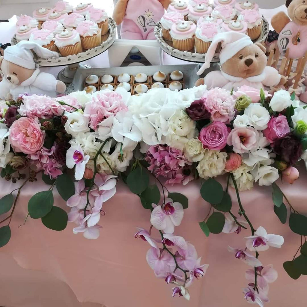 baptism with flowers and teddy bears in the baby's room