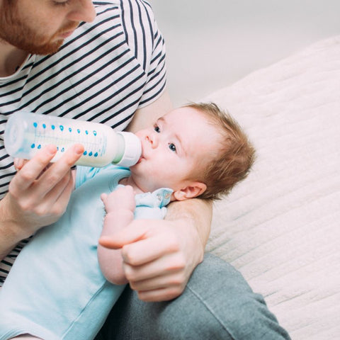 daddy feeds baby