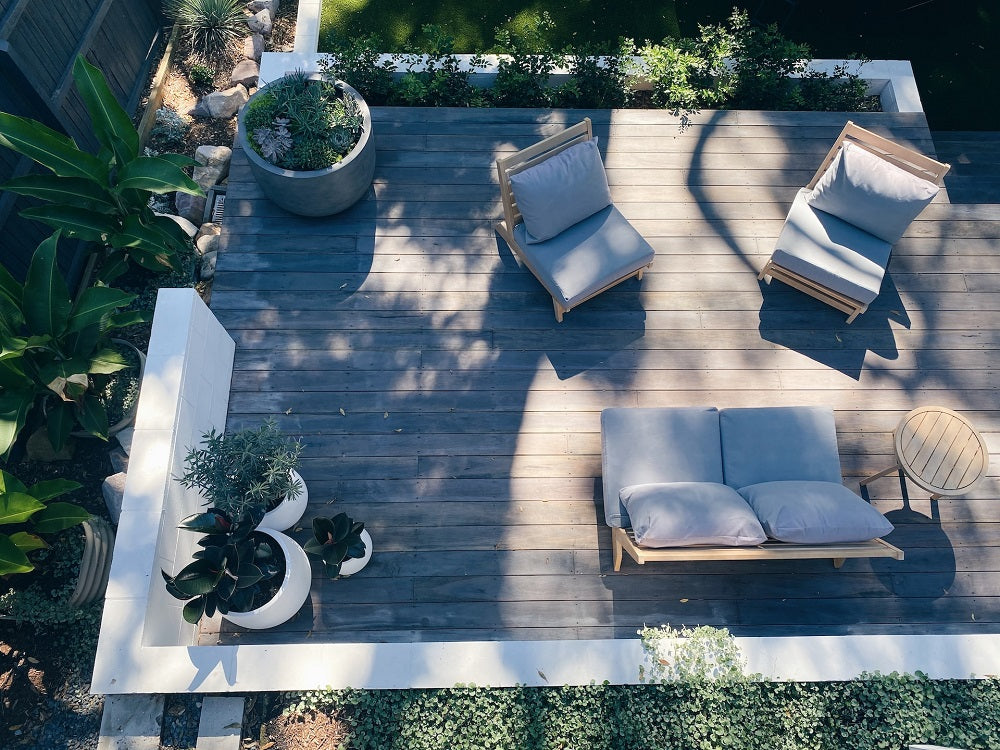 An overhead shot of the sofa set in the courtyard, bathed in sunlight