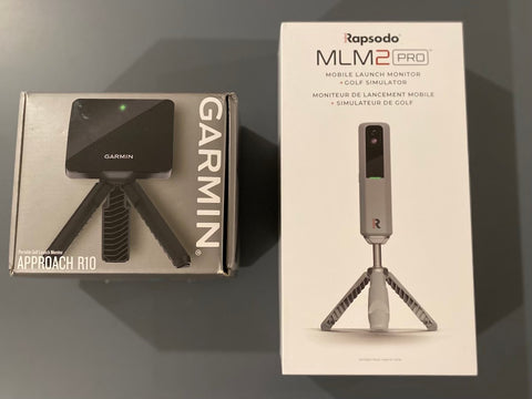 The Garmin R10 and Rapsodo MLM2PRO launch monitors in side by side in their packages