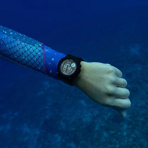 The Garmin Descent G1 dive and multisport GPS watch on the wrist of a diver underwater